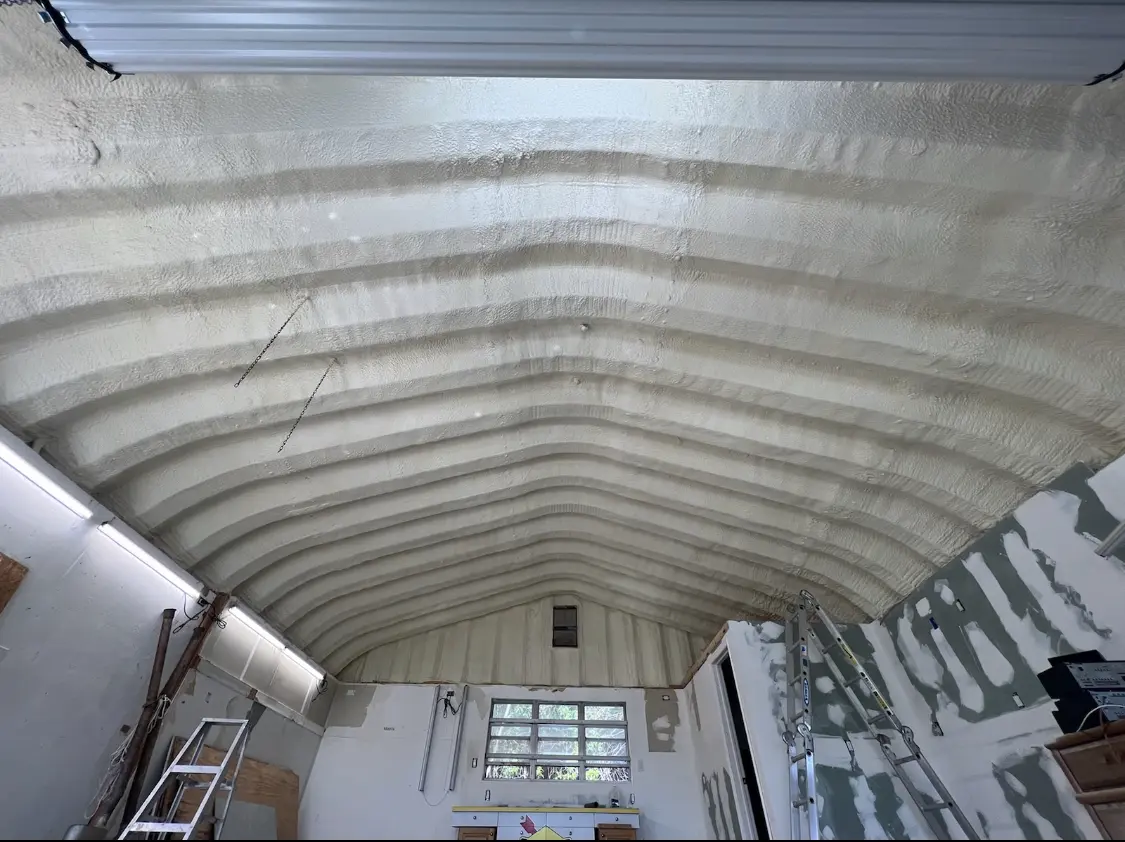 Spray polyurethane foam applied to the underside of a metal roof deck in Hiram